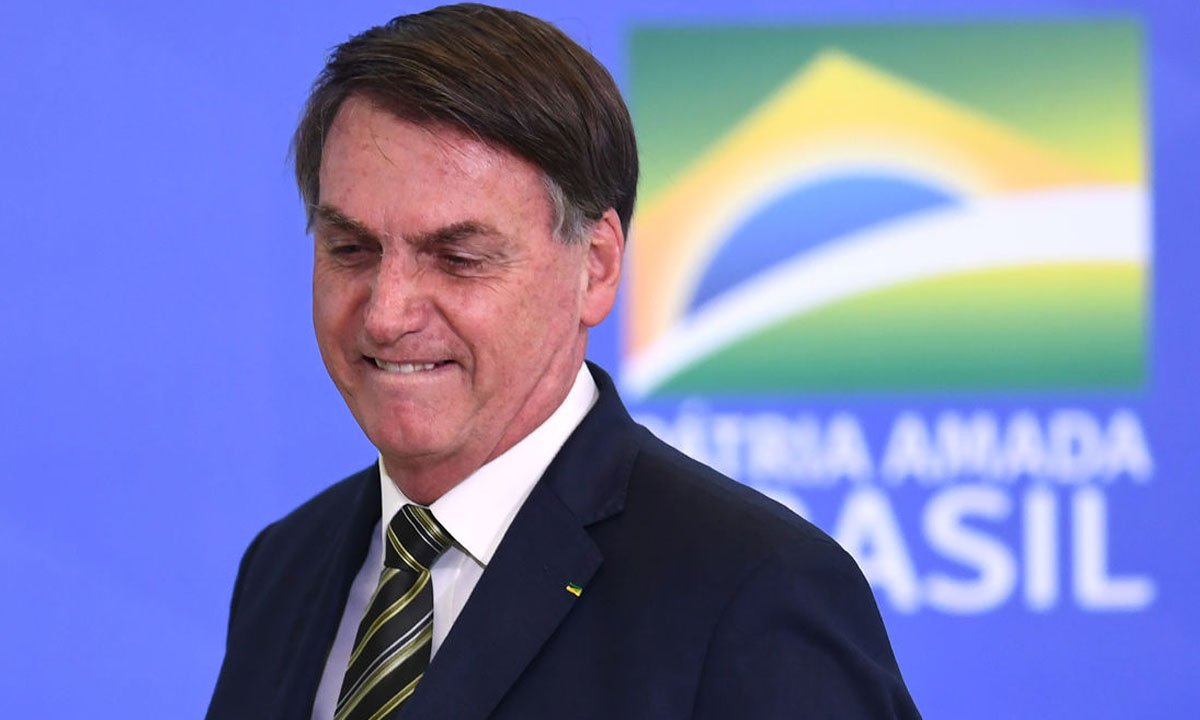 Por que candidatos aliados a Bolsonaro são perigosos à democracia?
